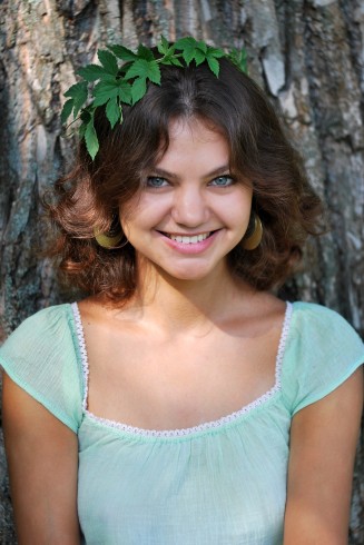 Canva Smiling Woman Wearing a Leaf Crown 1